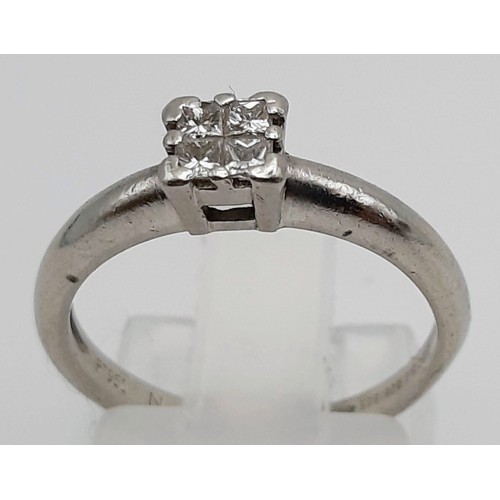 504 - A Platinum Four-Stone Diamond Square-Cut Ring.
0.20ct. Size L. 4.1g