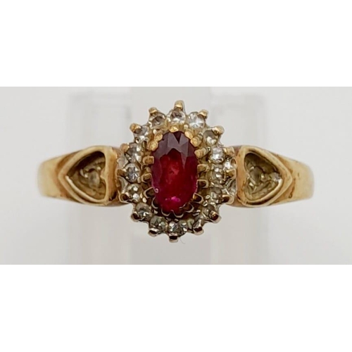 545 - A 9K Yellow Gold Ruby and Diamond Ring. Central ruby surrounded by a halo of diamonds. Size P. 2.5g