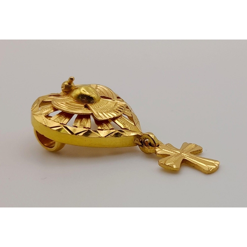 62 - An 18 K yellow gold pendant. Heart shaped with a central pigeon (symbol of peace) and a cross pendan... 