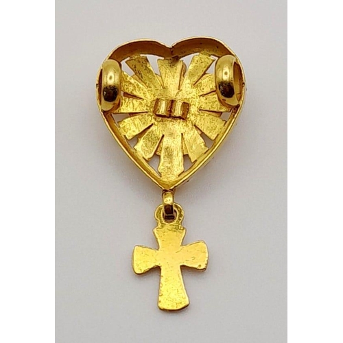 62 - An 18 K yellow gold pendant. Heart shaped with a central pigeon (symbol of peace) and a cross pendan... 