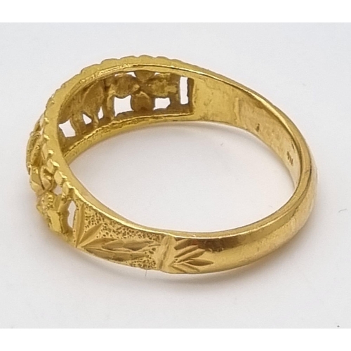 73 - An 18 K yellow gold ring with pierced design. Ring size: X, weight: 7.4 g.