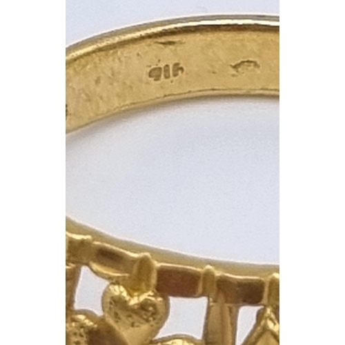 73 - An 18 K yellow gold ring with pierced design. Ring size: X, weight: 7.4 g.