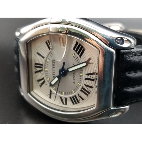 144 - A Cartier Roadster Automatic Gents Watch. Black leather strap with stainless steel case-38mm. Silver... 