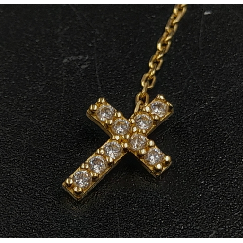 153 - A Disappearing 14K Yellow Gold Necklace and a 14k Yellow Gold Pair of Drop Cross Earrings. 50cm and ... 