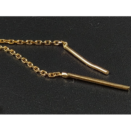 153 - A Disappearing 14K Yellow Gold Necklace and a 14k Yellow Gold Pair of Drop Cross Earrings. 50cm and ... 