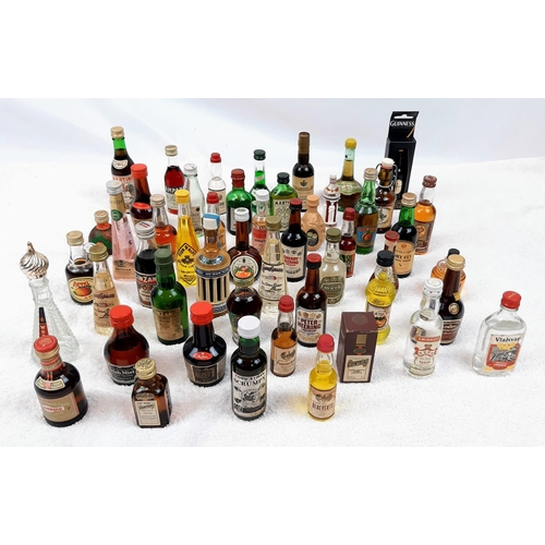 211 - 50 MINATURE BOTTLES OF INTERESTING ALCOHOLIC
DRINKS .