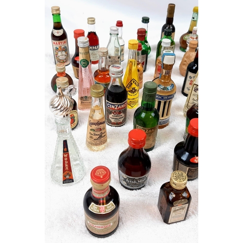 211 - 50 MINATURE BOTTLES OF INTERESTING ALCOHOLIC
DRINKS .