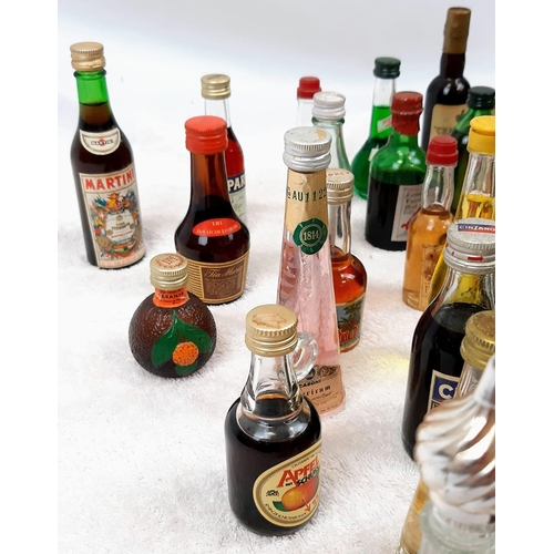 211 - 50 MINATURE BOTTLES OF INTERESTING ALCOHOLIC
DRINKS .