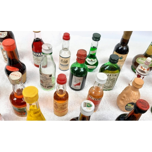 211 - 50 MINATURE BOTTLES OF INTERESTING ALCOHOLIC
DRINKS .