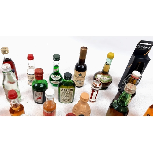 211 - 50 MINATURE BOTTLES OF INTERESTING ALCOHOLIC
DRINKS .