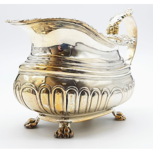 480 - A GEORGIAN HALLMARKED SILVER SAUCE BOAT WITH ORNATE LIP AND CLAW FEET , VERY NICE CONDITION. 222gms ... 