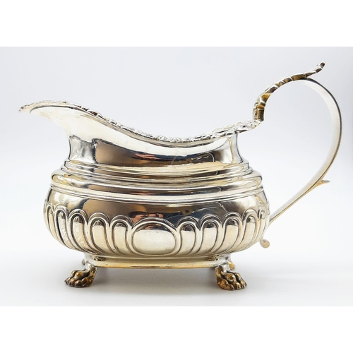 480 - A GEORGIAN HALLMARKED SILVER SAUCE BOAT WITH ORNATE LIP AND CLAW FEET , VERY NICE CONDITION. 222gms ... 