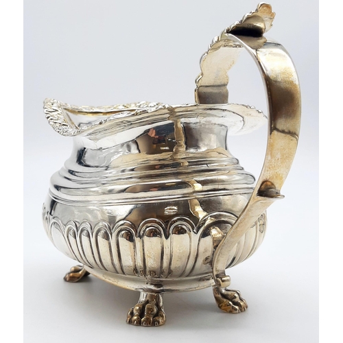 480 - A GEORGIAN HALLMARKED SILVER SAUCE BOAT WITH ORNATE LIP AND CLAW FEET , VERY NICE CONDITION. 222gms ... 