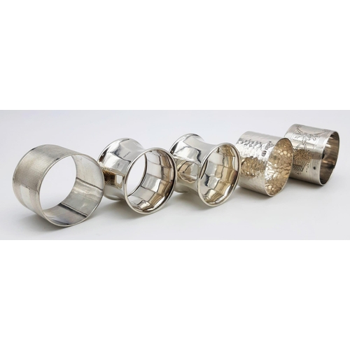 478 - 5 VINTAGE SILVER NAPKIN RINGS. 144.4gms