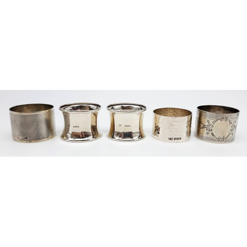 478 - 5 VINTAGE SILVER NAPKIN RINGS. 144.4gms