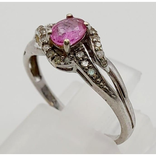 525 - A 9K White Gold Pink Sapphire and Diamond Cluster Ring. 0.10ct. Size K 1/2. 1.7g