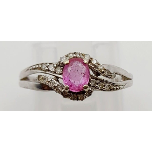 525 - A 9K White Gold Pink Sapphire and Diamond Cluster Ring. 0.10ct. Size K 1/2. 1.7g