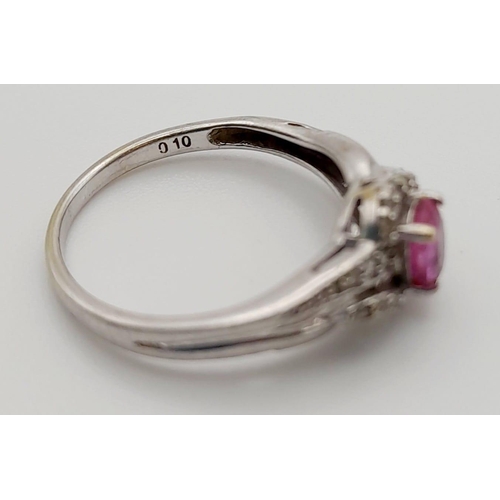 525 - A 9K White Gold Pink Sapphire and Diamond Cluster Ring. 0.10ct. Size K 1/2. 1.7g