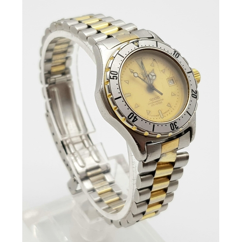 531 - A Tag Heuer 200m Ladies Diver Watch. Two-tone strap and case - 27mm. Gold tone dial with date window... 