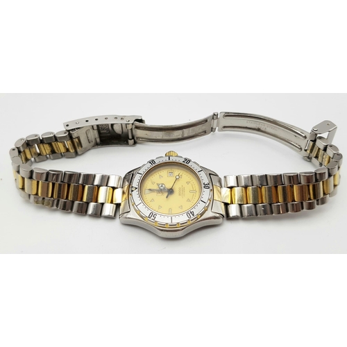 531 - A Tag Heuer 200m Ladies Diver Watch. Two-tone strap and case - 27mm. Gold tone dial with date window... 