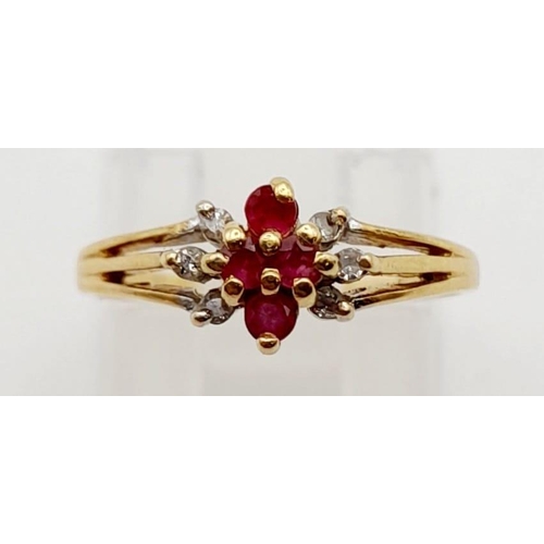 552 - A 14K Yellow Gold Diamond and Ruby Cluster Ring. Size J. 1.7g