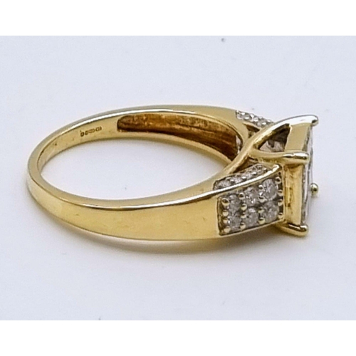 581 - A 9K YELLOW GOLD FANCY DIAMOND RING HAVING 0.50 DIAMONDS IN TOTAL .   3.4gms    size O