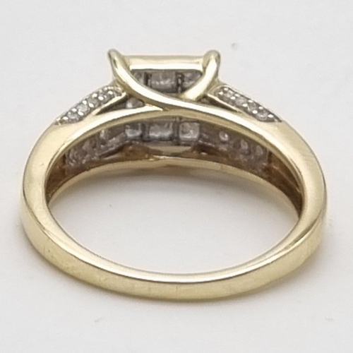 581 - A 9K YELLOW GOLD FANCY DIAMOND RING HAVING 0.50 DIAMONDS IN TOTAL .   3.4gms    size O