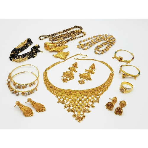 13 - A MIXED LOT OF JEWELLERY TO INCLUDE:
A 21K GOLD BLACK STONE SET NECKLACE AND RING. 42.85gms.
AN 18K ... 