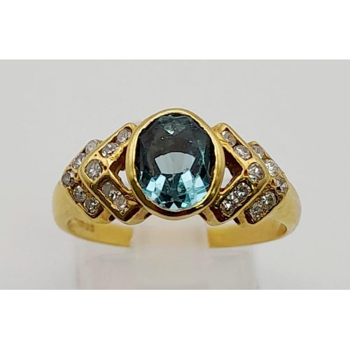 32 - An 18 K yellow gold ring with an oval cut aquamarine and diamonds on the shoulders. Ring size: P, we... 