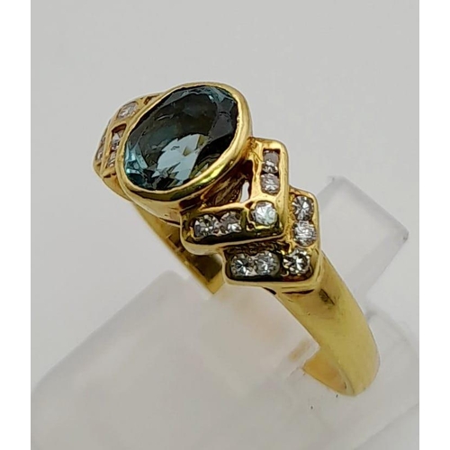 32 - An 18 K yellow gold ring with an oval cut aquamarine and diamonds on the shoulders. Ring size: P, we... 