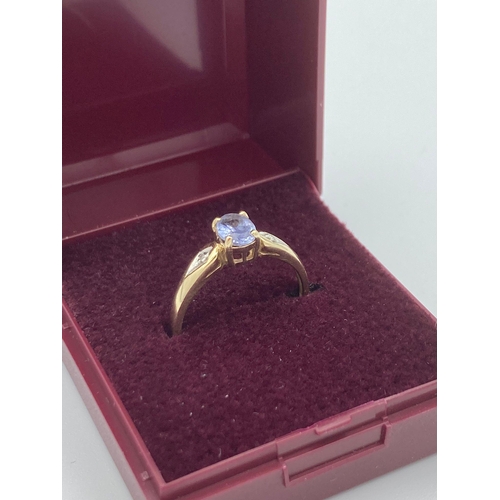 50 - 9 carat GOLD and TANZANITE RING, having oval Tanzanite solitaire with diamond point shoulders.
Full ... 