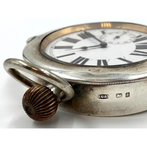 95 - An Antique Silver Goliath Pocket Watch. Comes with hanger attachment at rear. White dial with sub se... 