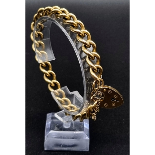 592 - A 9K Yellow Gold Twisted Curb Link Bracelet with Heart Clasp. 20cm. 39.83g