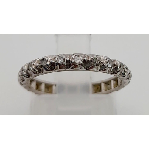 121 - An unusual, 9 K white gold, eternity ring with diamonds. Ring size: L, weight: 2.25 g.