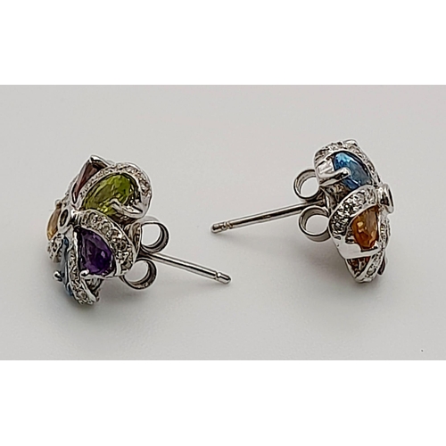 425 - A PAIR OF MULTI GEMSTONE EARRINGS SET IN 9K WHITE GOLD.3.17gms