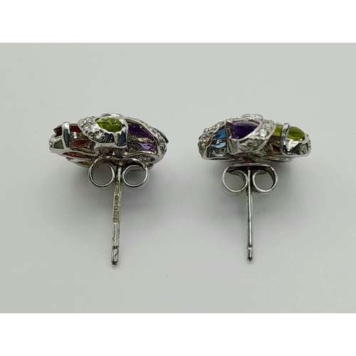 425 - A PAIR OF MULTI GEMSTONE EARRINGS SET IN 9K WHITE GOLD.3.17gms