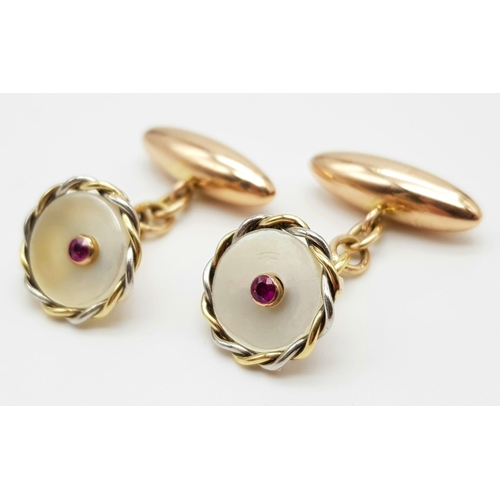 451 - A PAIR OF VICTORIAN 10K ROSE GOLD CUFFLINKS WITH MOTHER OF PEARL AND RUBY CENTRE STONE.   6.7gms