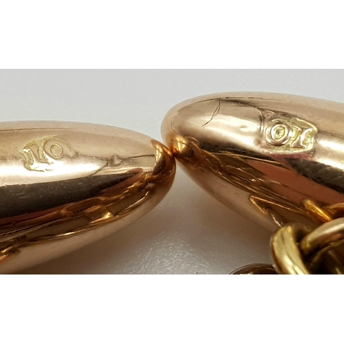 451 - A PAIR OF VICTORIAN 10K ROSE GOLD CUFFLINKS WITH MOTHER OF PEARL AND RUBY CENTRE STONE.   6.7gms