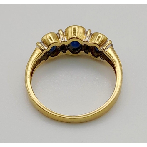 67 - An 18 K yellow gold ring with blue sapphires and diamonds. Ring size: K, weight: 3.03 g.