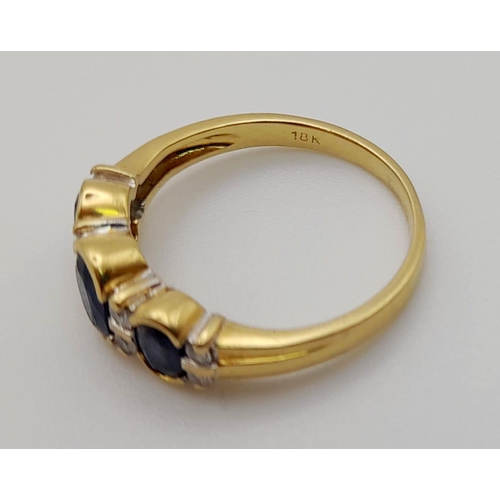 67 - An 18 K yellow gold ring with blue sapphires and diamonds. Ring size: K, weight: 3.03 g.