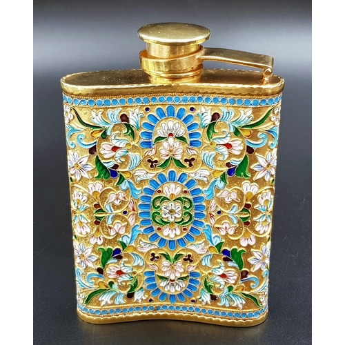 205 - A Delightful Russian Silver and Cloisonné Enamel Hip Flask. Floral decoration and rich gilding throu... 