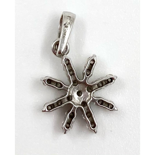 129 - 18K White Gold Diamond Set Snowflake Pendant 1g 0.20ct