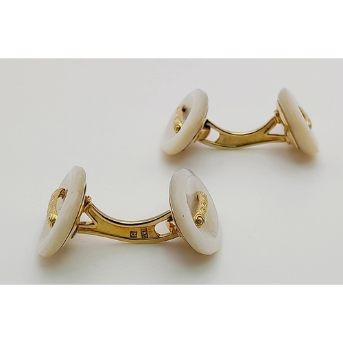 466 - A PAIR OF MOTHER OF PEARL CUFF LINKS SET IN 14K GOLD.  7.3gms