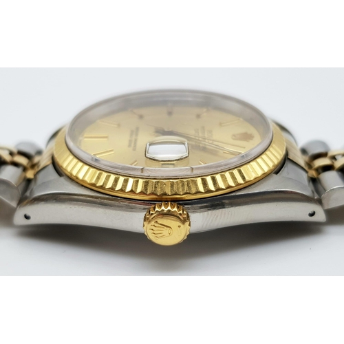 100 - A gents ROLEX Oyster Perpetual Datejust stainless steel and 18 K yellow gold watch. 36 mm dial, with... 