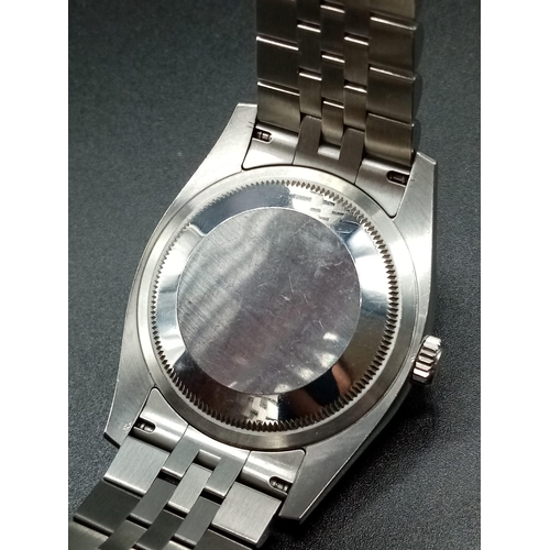 107 - A gents ROLEX Oyster Perpetual Datejust, stainless steel watch. 36 mm dial with white metal face, ha... 