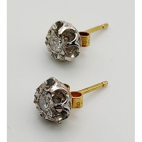 232 - A PAIR OF 9K GOLD DIAMOND STUD EARRINGS.  2.4gms