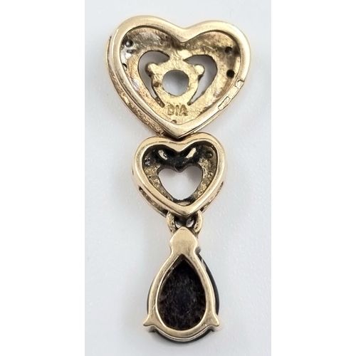 265 - 9K Yellow Gold Diamond & Garnet Heart Pendant 1.6g