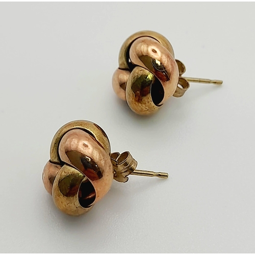 410 - A PAIR OF YELLOW AND ROSE GOLD EARRINGS  IN A KNOT SHAPE,   2gms