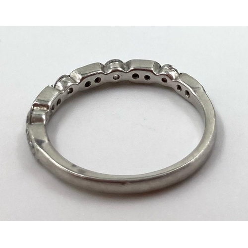 459 - A PLATINUM HALF ETERNITY RING WITH .25CT DIAMONDS.  2.15gms   size H/I