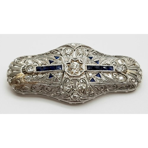 47 - A beautiful Art deco 18 K white gold brooch with Diamonds and blue sapphires. Dimensions: 44 x 21 x ... 